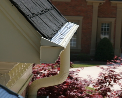 gutters-atlanta-3 Half round gutters with decorative downspouts on home exterior