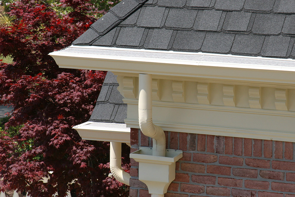 gutters-atlanta-7 White half-round gutters with matching downspouts