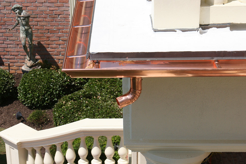 gutters-atlanta-8 Detailed downspout and gutter transition on brick home