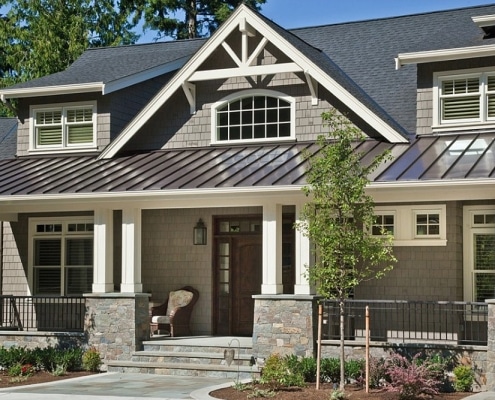Craftsman-style home featuring black metal roof system