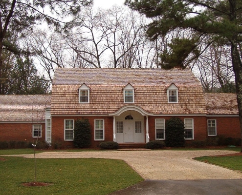 Cedar shake roof installation on traditional brick home in Georgia