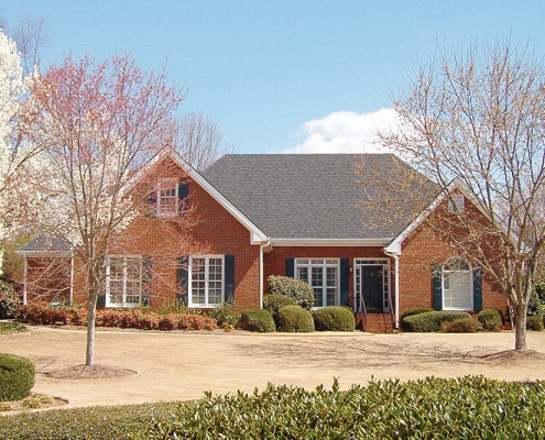 Residential home with natural slate roofing installed by Academy Roofing