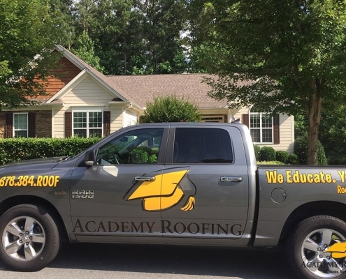 Academy Roofing service truck at a Georgia residential project site