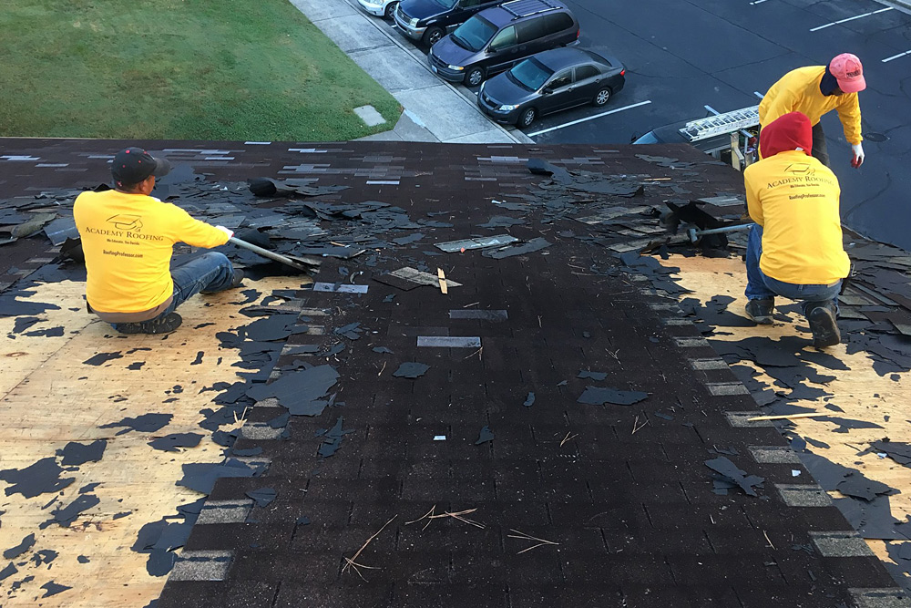 roof-repair-atlanta-2 Mid-repair asphalt shingle roofing with underlayment exposed