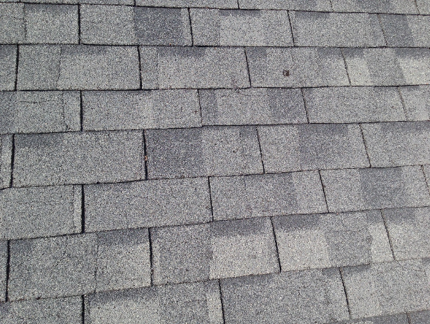 Chalet roofs had severe cracking, blistering, and early granule loss
