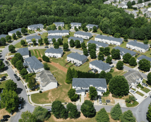 Aerial photo of residential neighborhood in Acworth, GA showing rooftops and surrounding trees