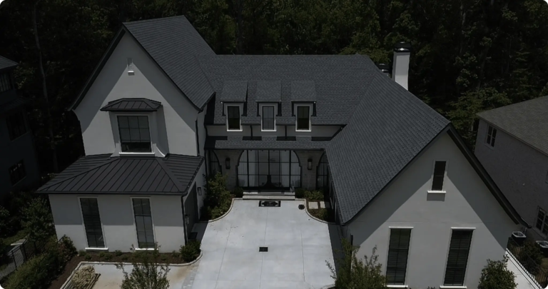 Modern two-story white home with a newly installed dark asphalt shingle roof in Atlanta
