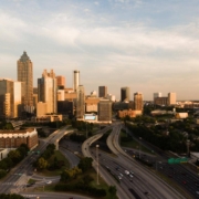 Downtown Atlanta skyline showing commercial buildings and highway, representing the region impacted by 2026 commercial roofing code updates