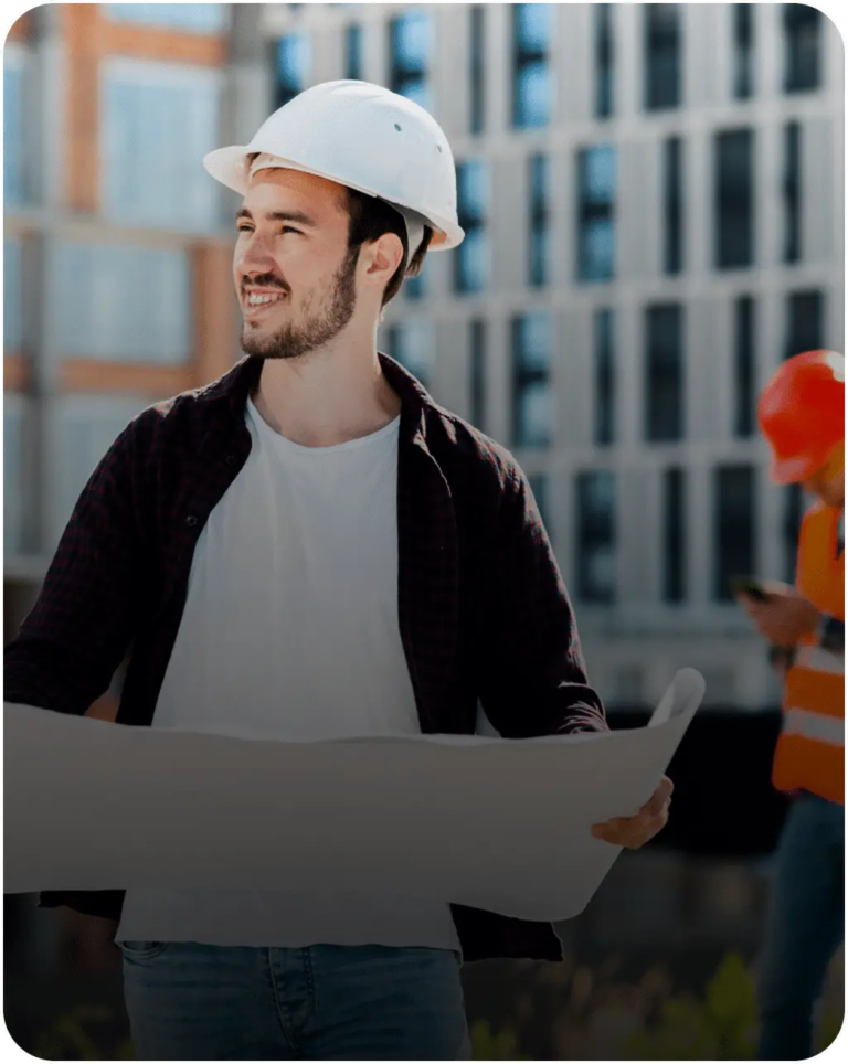 Commercial roofing professional reviewing site plans on location near a multifamily or office building