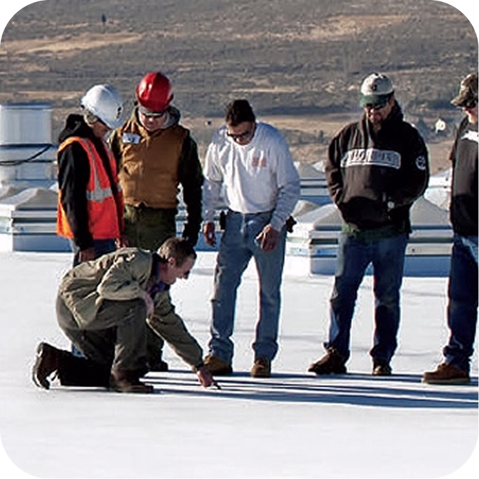 Roofing team performing a commercial roof assessment before project planning