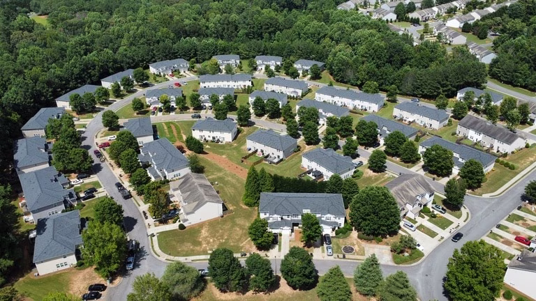 Aerial view of multifamily commercial property with completed roofing project